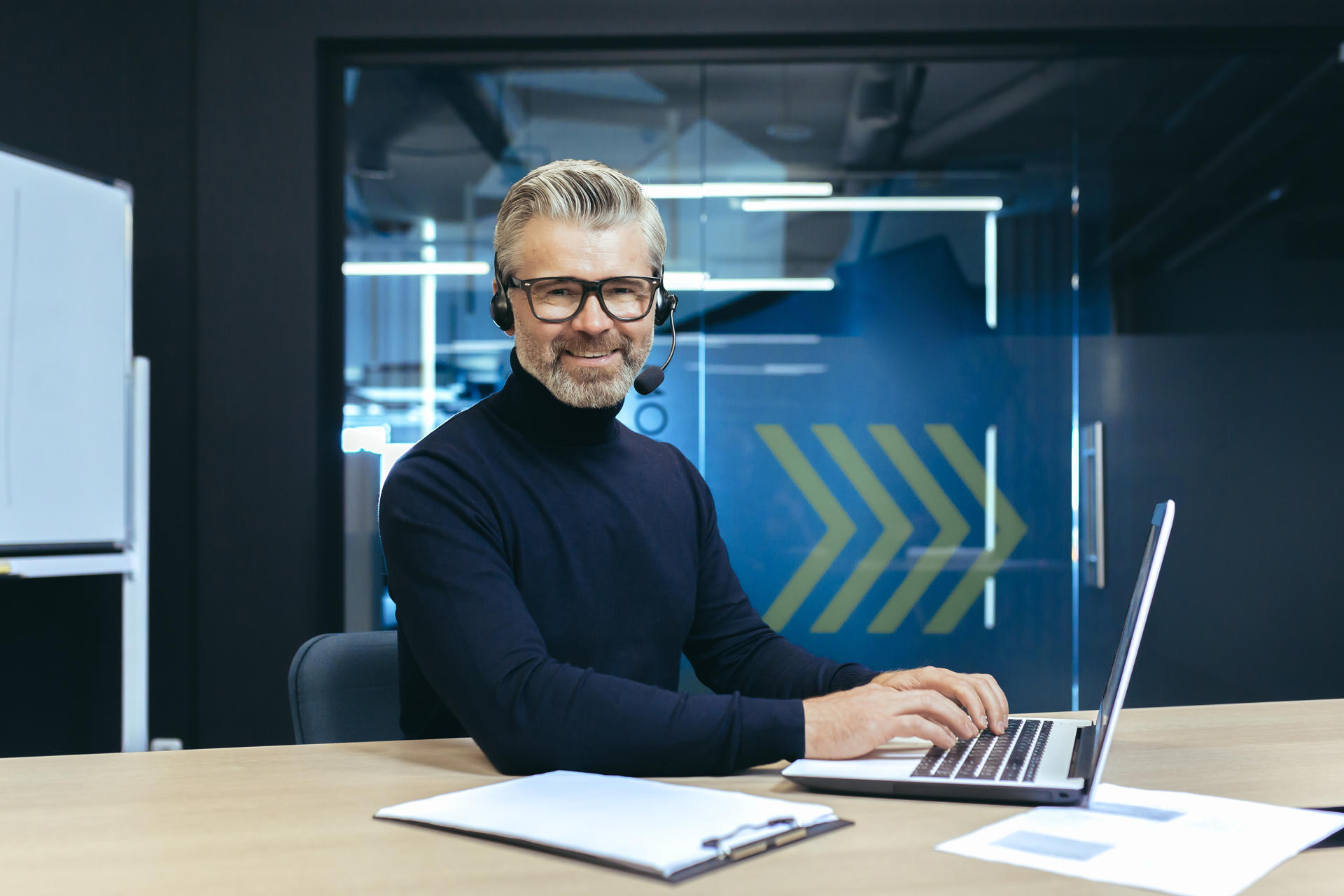 a-gray-haired-handsome-businessman-with-a-headset-2025-04-02-22-33-38-utc.jpg